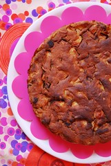 Homemade apple cake on colorful background