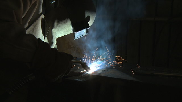 Arc welder in fabrication shop