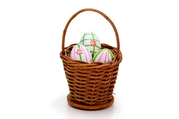 Fototapeta na wymiar Easter eggs into a basket