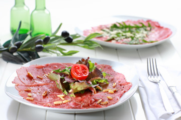 Carpaccio with salad and pine nut