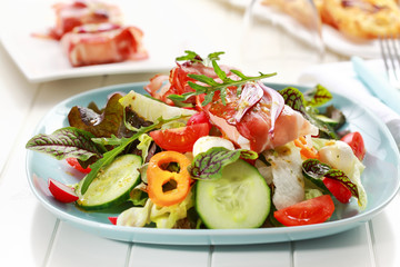 Vegetable salad with Prosciutto cheese rolls