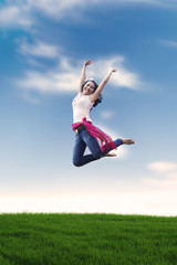 Excited Asian woman jumping