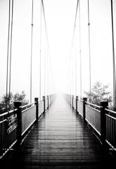 Rollo view on pedestrian wooden bridge in mist © naxaso