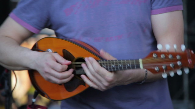 Playing the mandolin