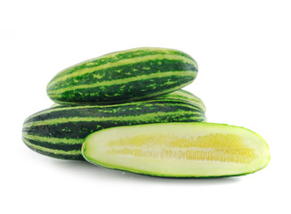 Cucumber and slices isolated over white background