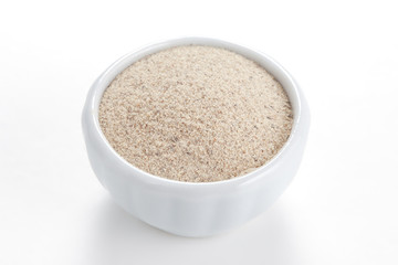 White Pepperground in a white bowl on white background.