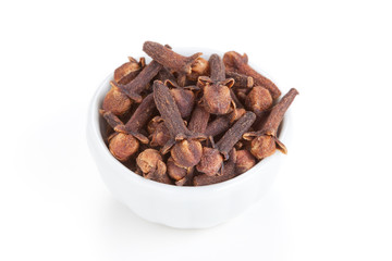 Clove (Syzygium aromaticum)  in a white bowl on white background