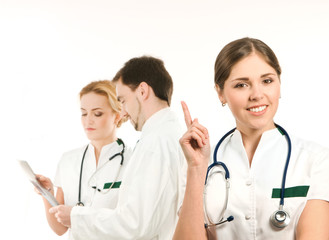 Fototapeta premium A team of young Caucasian doctors in white clothes