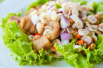 Thai dressed spicy salad with bass, green herbs and nuts