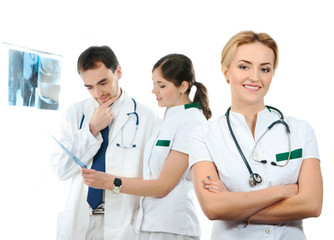 Fototapeta premium A team of young Caucasian doctors in white clothes