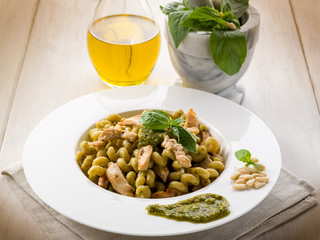 pasta with pesto sauce and chicken breast, healthy food