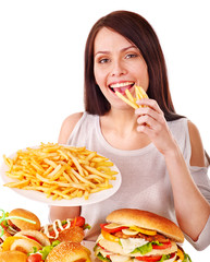 Woman eating fast food.