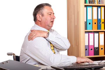 Man in office with shoulder pain