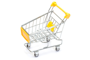 Yellow shopping cart on white