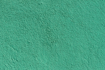 Light sea green plaster wall with old texture