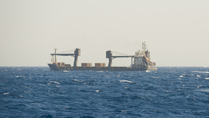 Small cargo ship at sea
