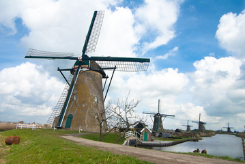 Fototapeta na wymiar Ancient windmils near Kinderdijk, Netherlands 