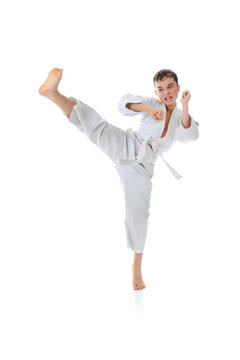 Young boy training karate.