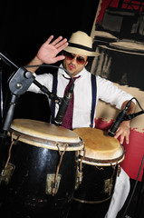 Cuban percussionist isolated on black