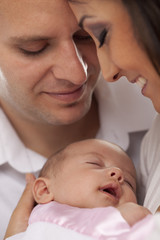 Mixed Race Young Couple with Newborn Baby