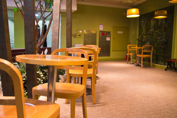 Details of an interior of a small cafe. Just chairs, empty frame