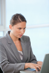 Businesswoman typing on a computer