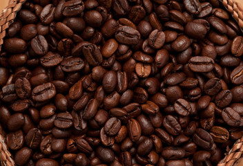 Fototapeta premium Close up of a basket full of dark coffee beans