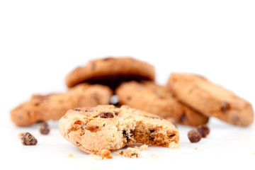 Half-eaten cookie in front of a stack of cookies