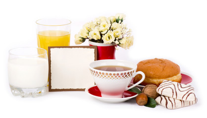 Beautiful tea set with cupcakes on white background