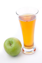 Fototapeta na wymiar Apple place near a glass of apple juice