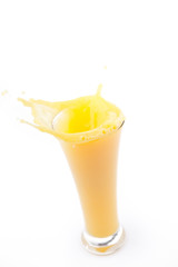 Overlowing glass of orange juice