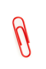 Close up of a red paperclip on the floor