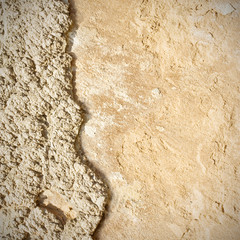 beige plastered wall as grunge background