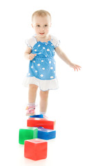 baby playing with colourful blocks