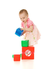 Baby playing with colourful blocks
