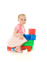 Baby playing with colourful blocks