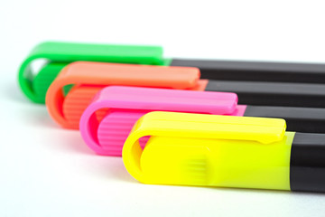 Colorful markers isolated on white background.