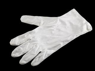 white textile glove. Isolated over black