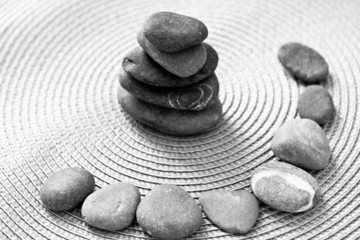 Fototapeta na wymiar stacked zen stones and stones in circle, bw