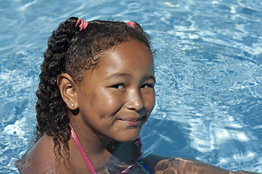 Young black girl in swimming pool