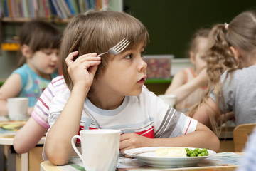 Little boy has a lunch