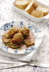 Meatballs with zucchini in tomato sauce