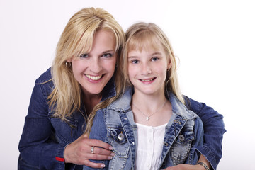Portrait of mother and daughter in jeans