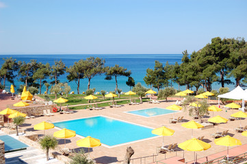 Swimming pool by a beach at the modern luxury hotel, Thassos isl