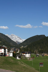 panorama of the Dolomites with houses and barns