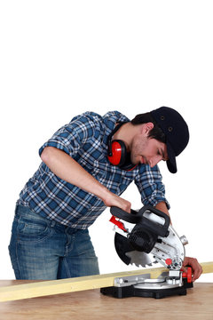 Man Using A Mitre Saw