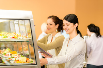 Cafeteria lunch young woman take salad plate