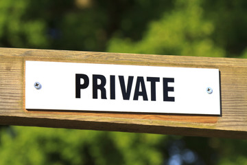 private sign on a wooden gate