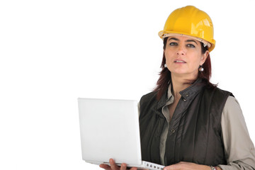 Female architect holding laptop computer