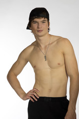 Fototapeta premium Naked waist young athlete with sporty cap